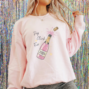 2025 New Year's Eve Pop Clink Fizz Women's Sweatshirt - Trendznmore