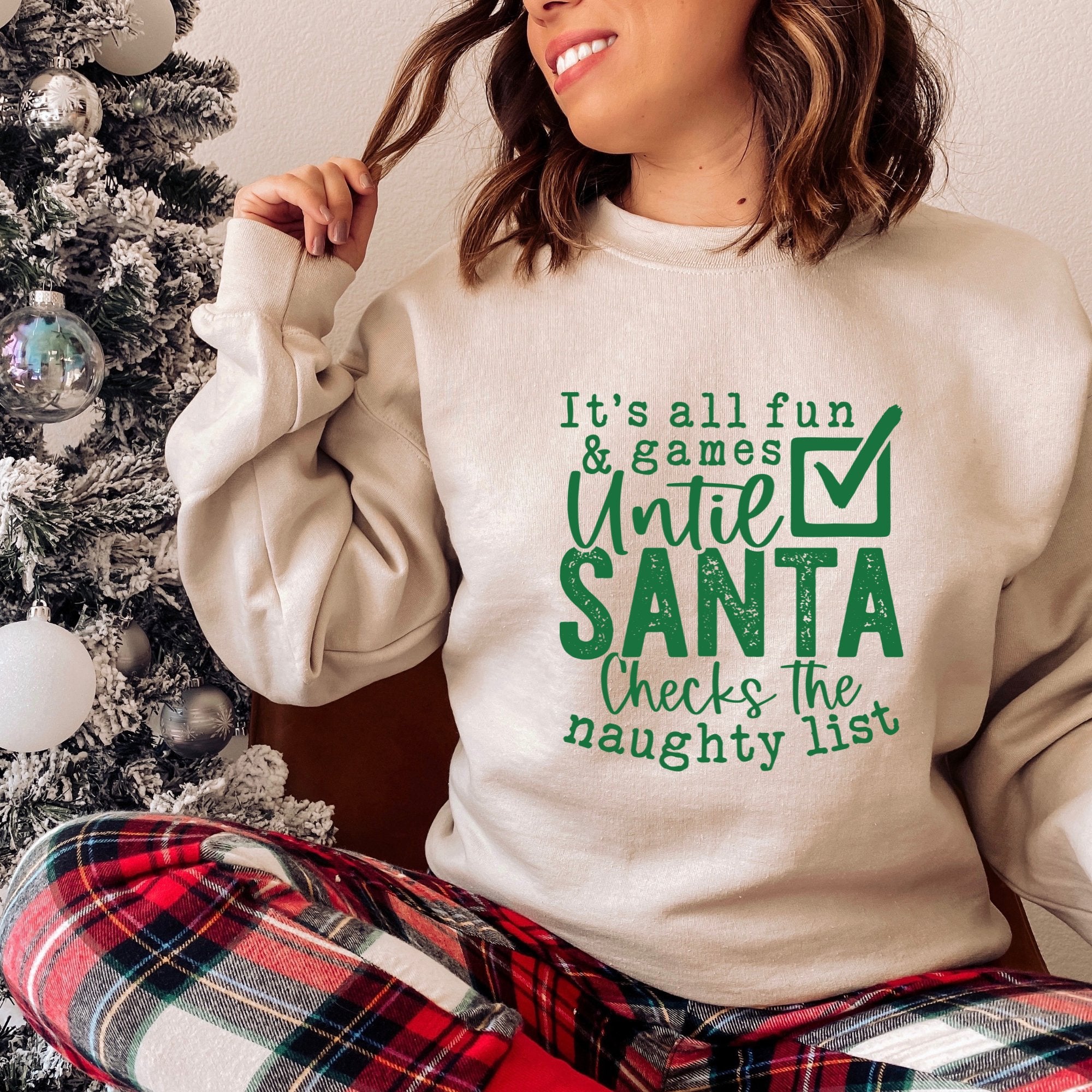 Green It's All Fun and Games Until Santa Checks Christmas Sweatshirt - Trendznmore